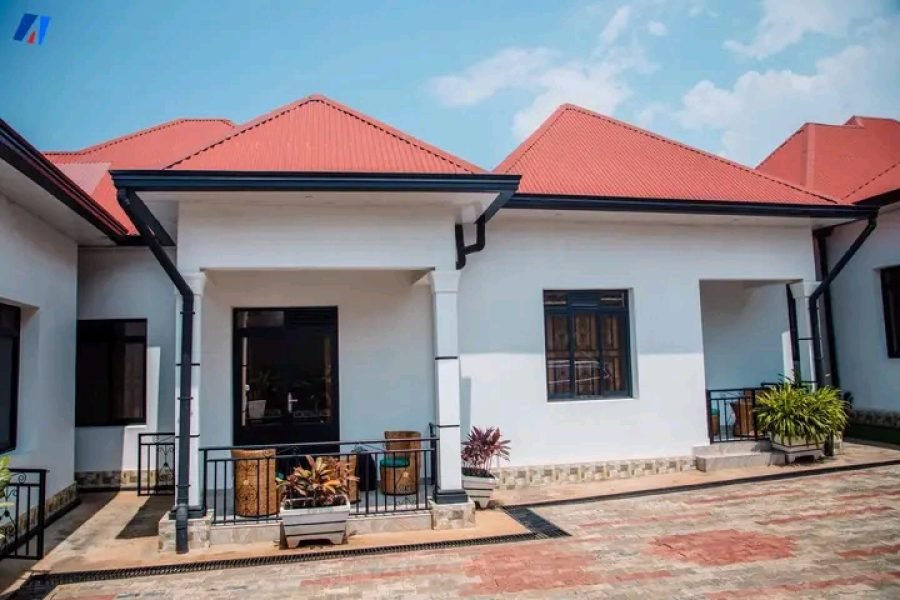 a white house for rent in Burundi with red roof