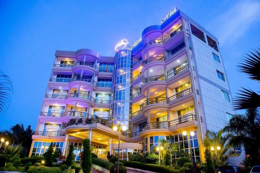 the front view of Martha Hotel in Bujumbura with trees outside